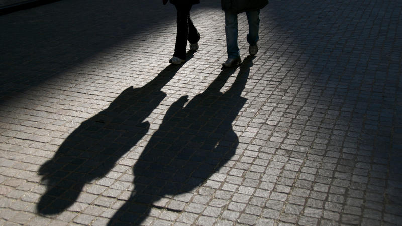 Walking shadows stock photo for safe walk service. 